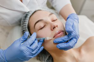 Closeup portrait of beautiful woman during cosmetology