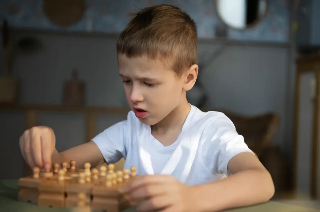 young-autistic-boy-playing-with-toys-at-home